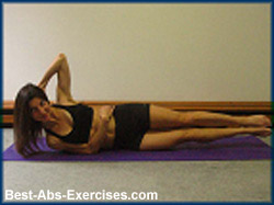 woman performing a side crunch exercise