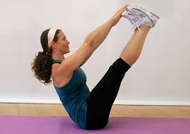 image of woman performing a jackknife sit up